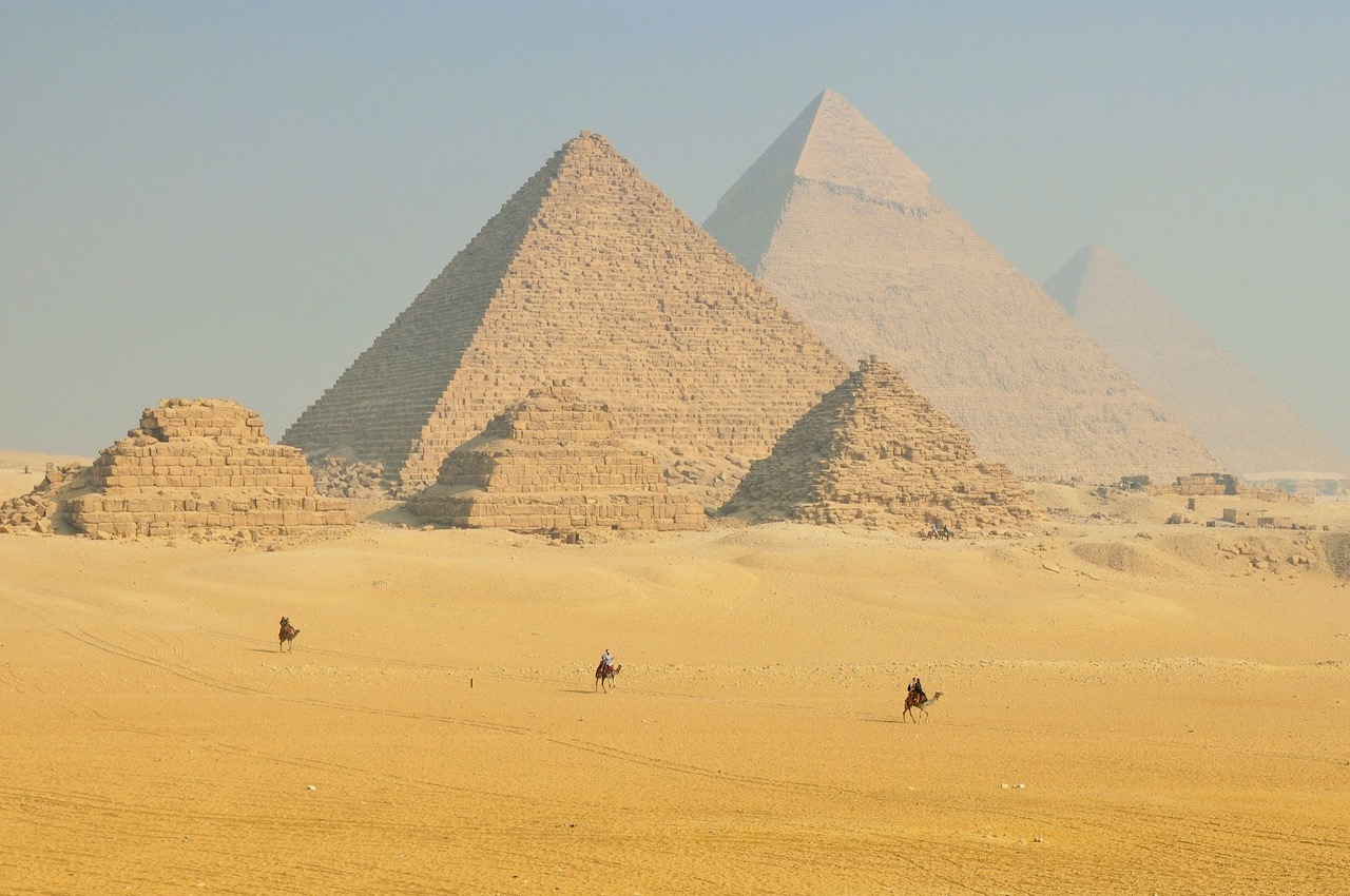 Pyramids of Giza from distance with camels – Engaging Cultures Travel